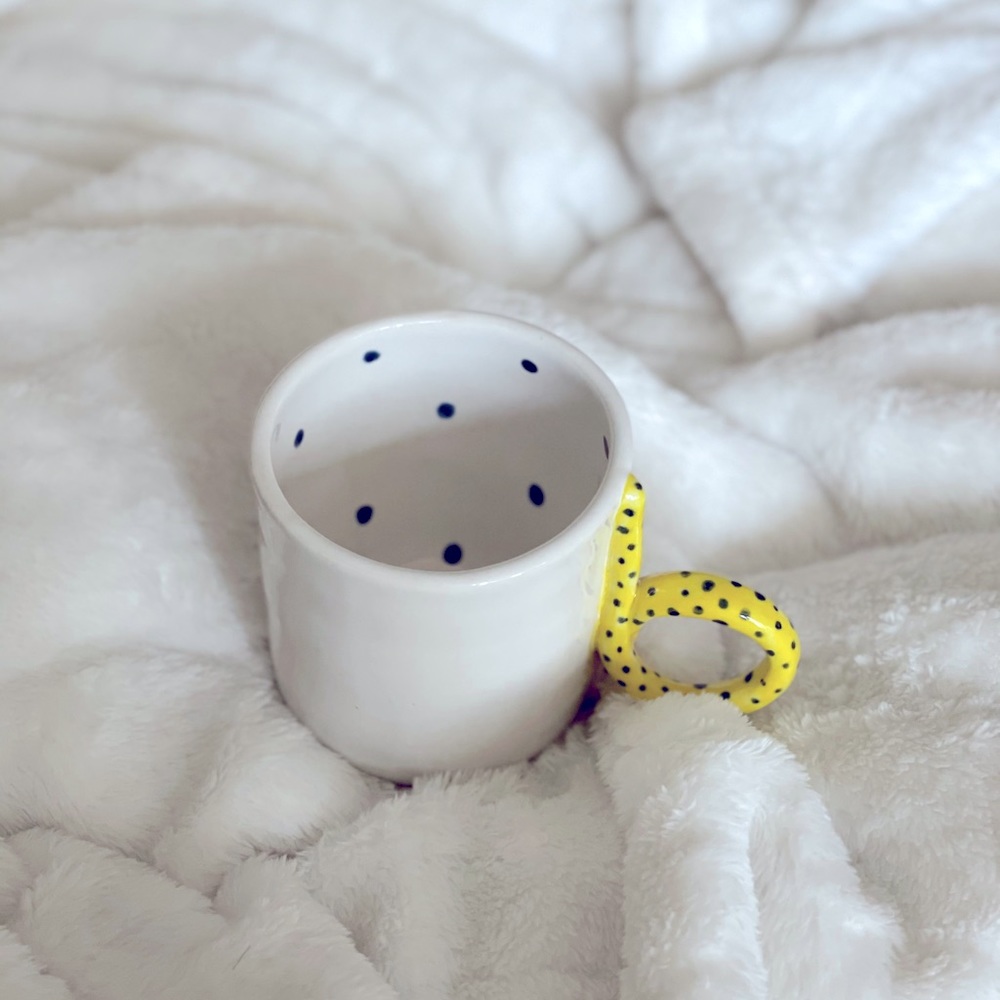 Handmade white and yellow with black dots mug